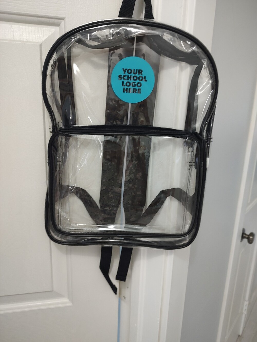 Clear backpack does have a spot with a blue circle that does not come off You co